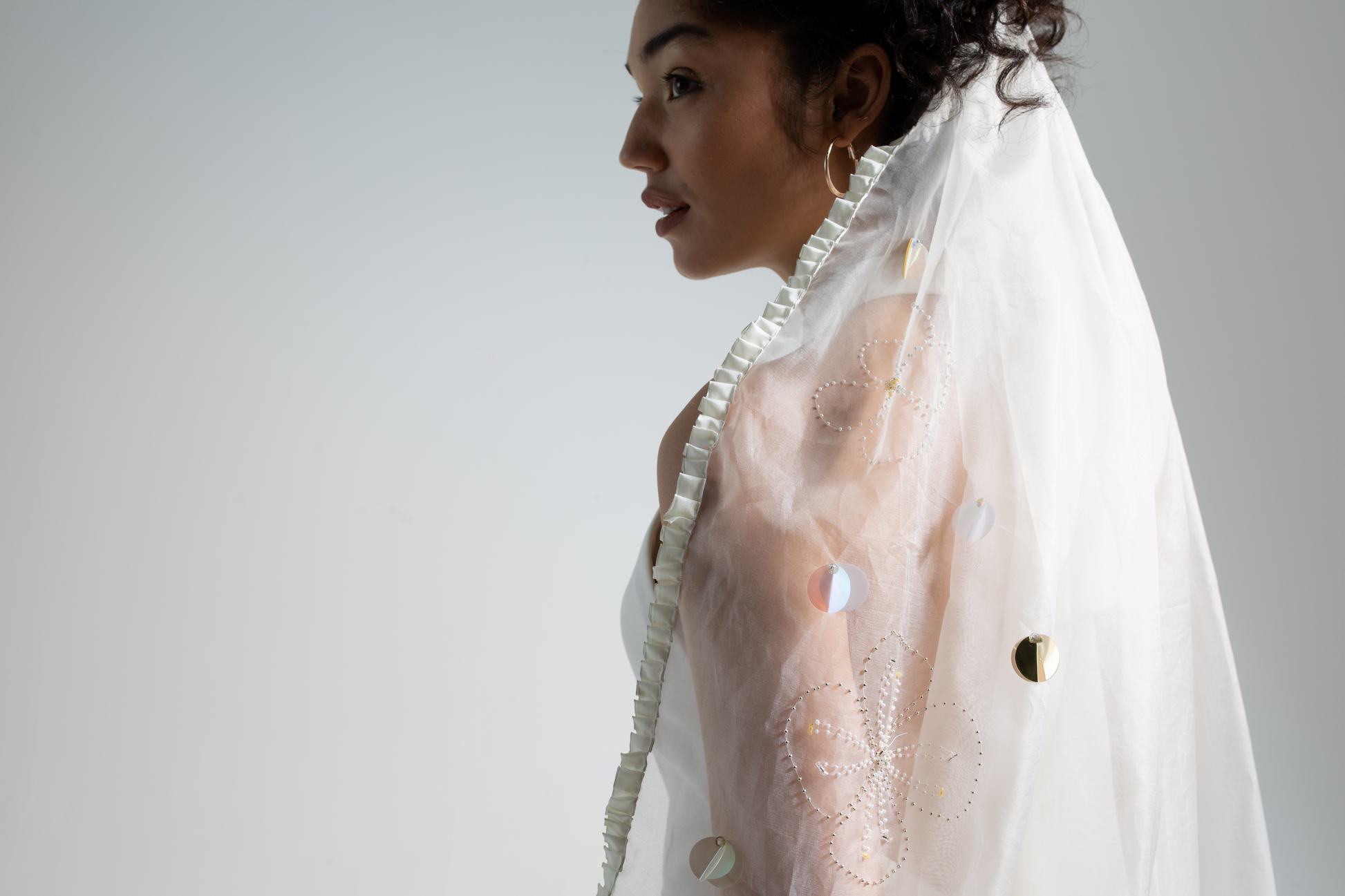 Silk organza embroidered veil, a highly decorative hand beaded floral embroidered veil from a collection of hand embellished, luxury bridal accessories, bridal headwear and veils.