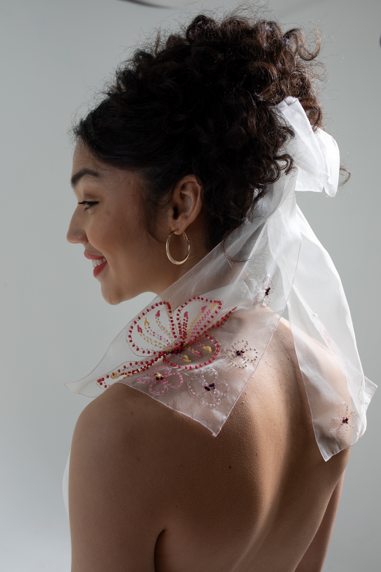 silk organza hand embroidered bow veil decorated with a hand beaded floral design, this bridal bow is part of a collection of luxury hand-embroidered bridal accessories, bridal headwear and veils