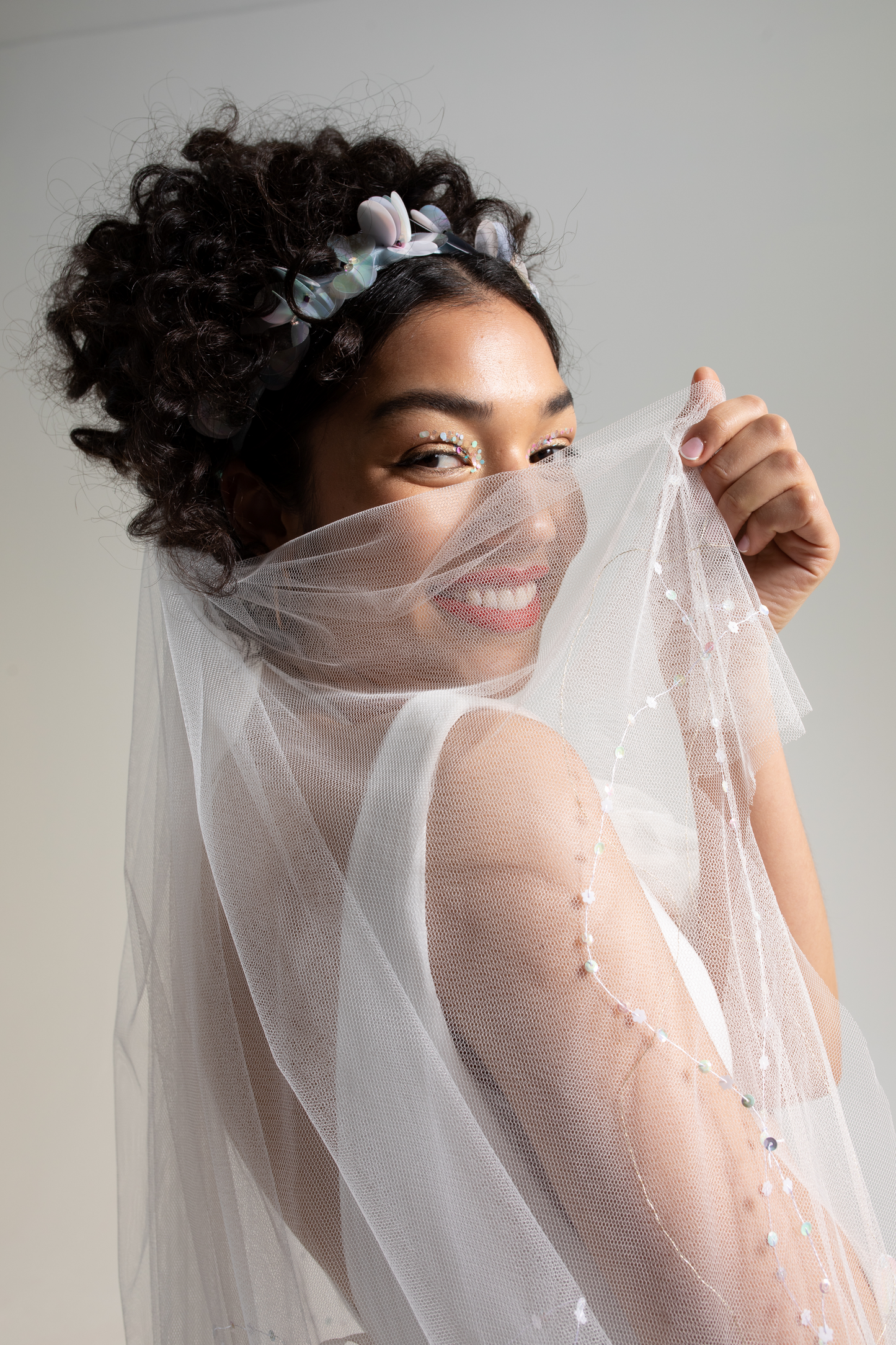 Soft tulle two tier hand embroidered veil hand embellished with hand sewn sequins and beads.  This embroidered veil is part of a collection of embellished bridal accessories and bridal headwear 