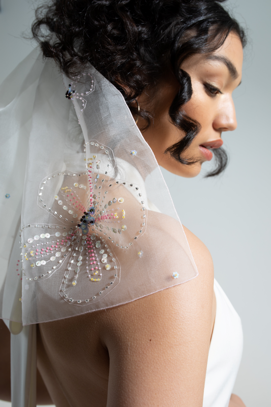 Hand embroidered wedding veil; subtly coloured sequins and beads hand-sewn onto a short silk organza bridal veil.  This floral embroidered wedding veil is part of a collection of luxury bridal accessories and bridal headwear.