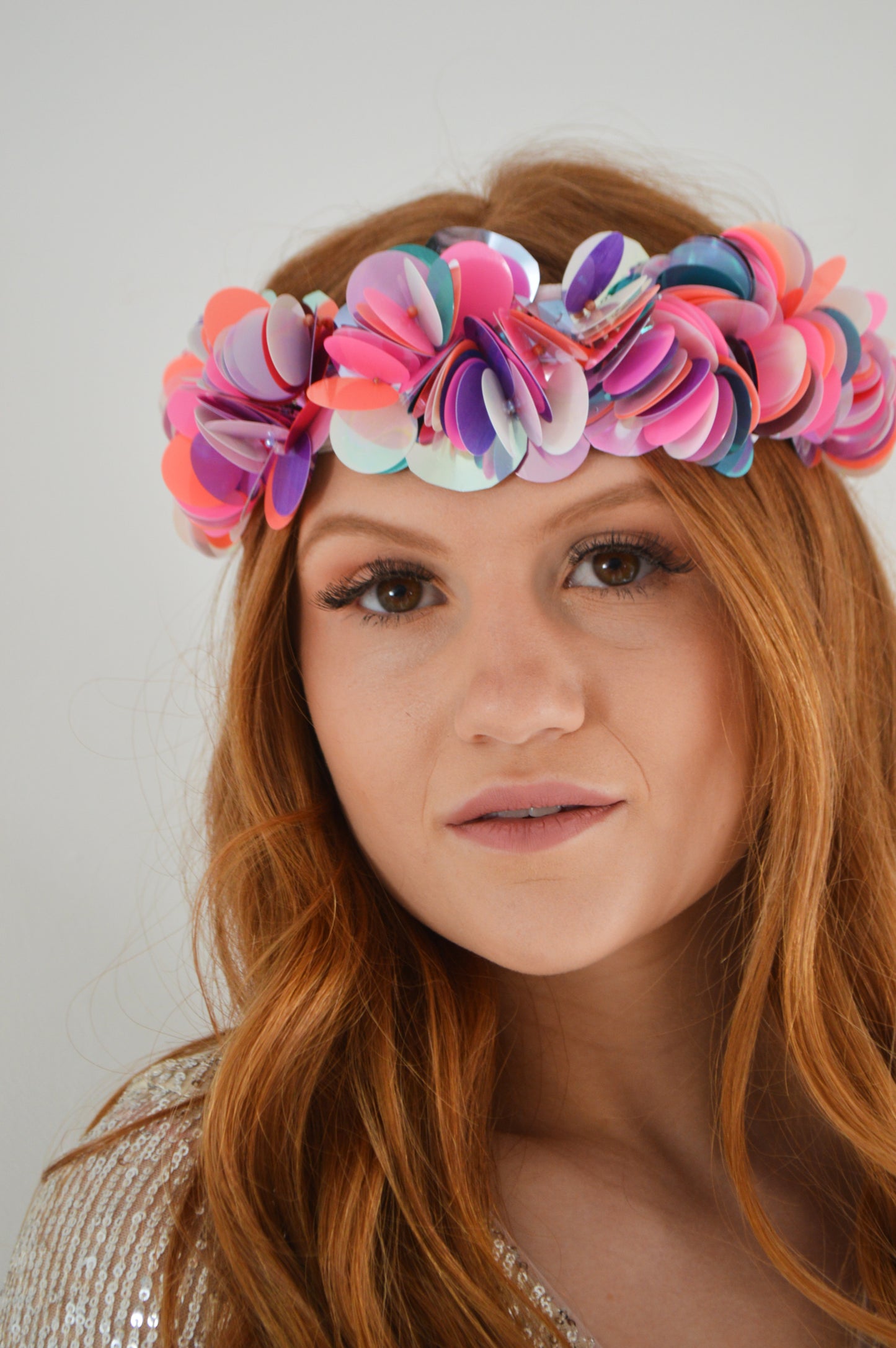Hand-sewn colourful sequin flower crown, a vibrant festival crown as part of a collection of festival headwear, bridal accessories and bridal headwear.